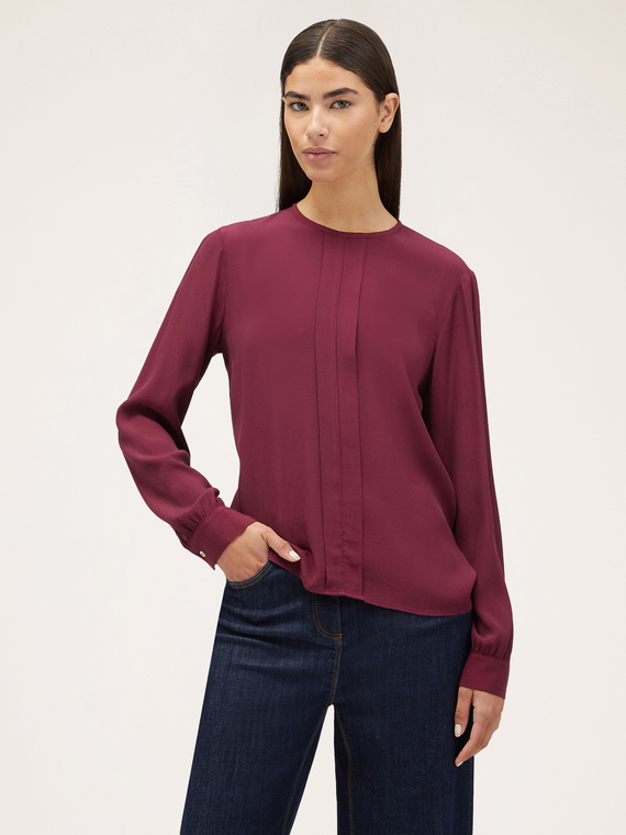 Blusa vaporosa con pliegue