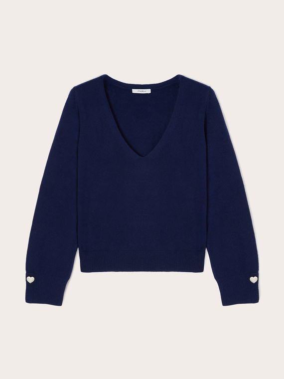 Pull avec bouton bijou sur les poignets