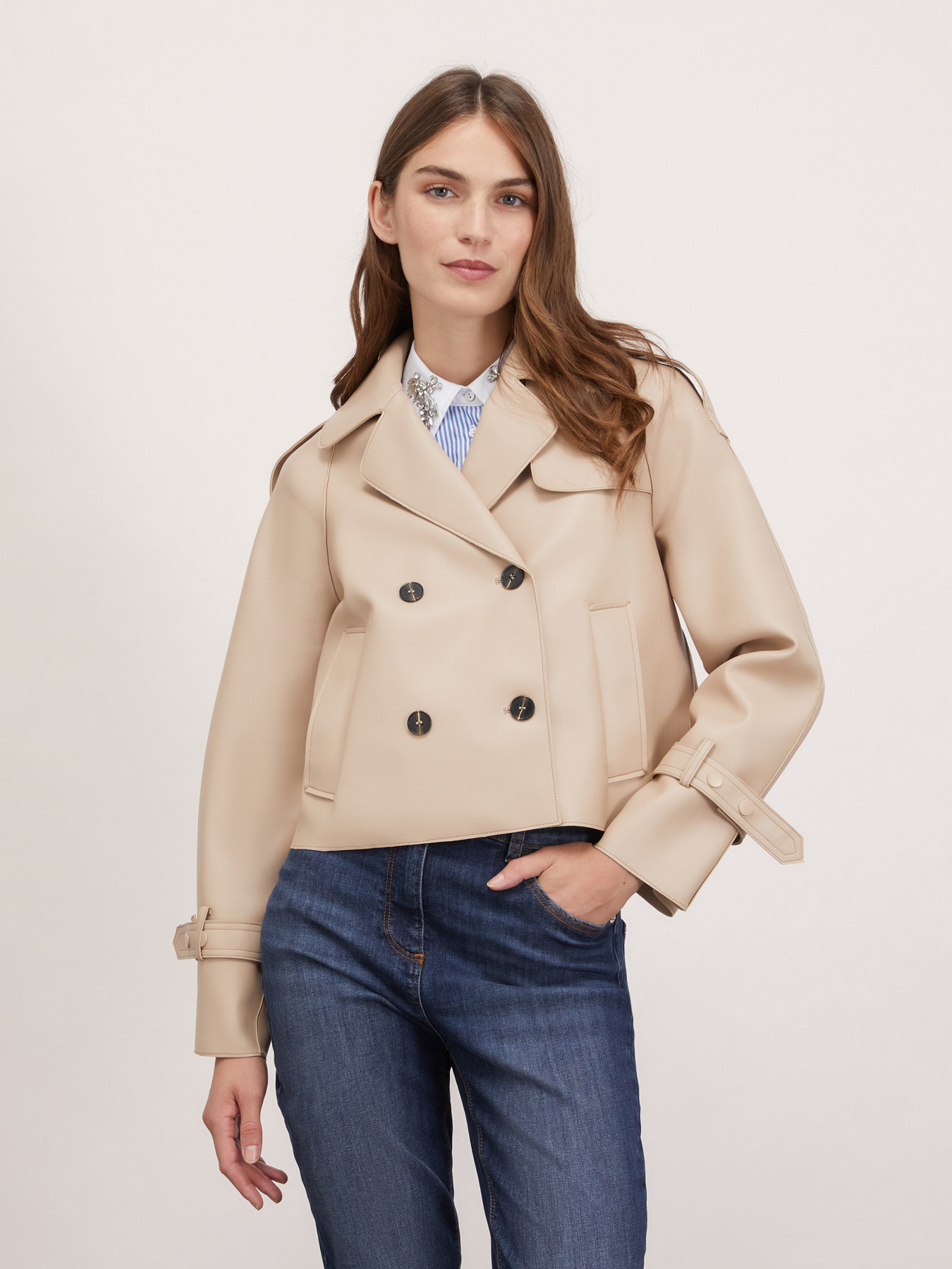 Short double breasted trench coat in coated fabric