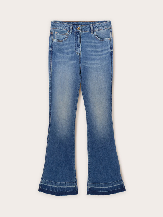 Flared jeans with frayed hem